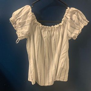 This shirt is off the shoulders and cropped